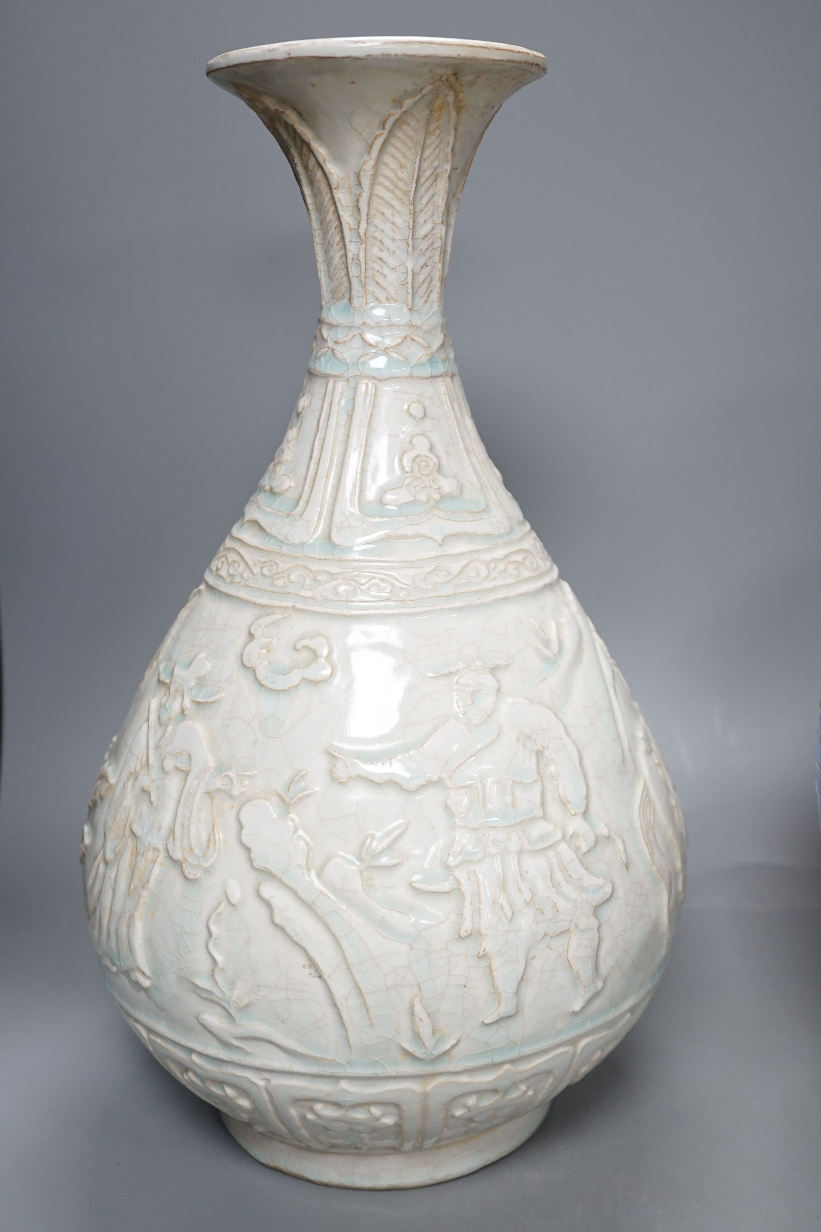 A Qingbai type bottle vase, a jar and cover, an apple green crackle glazed vase, a paper cut vase and a Song Dynasty style phoenix head bottle, tallest 38 cms high. (5)